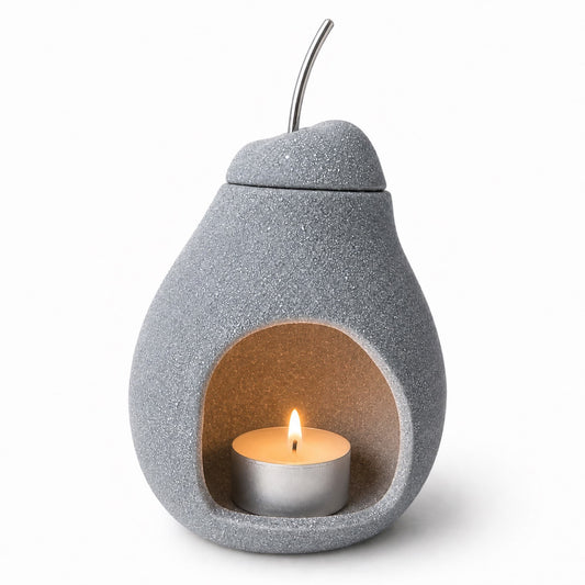 quemador de wax melts Nashi gris con vela de té encendida Ayre