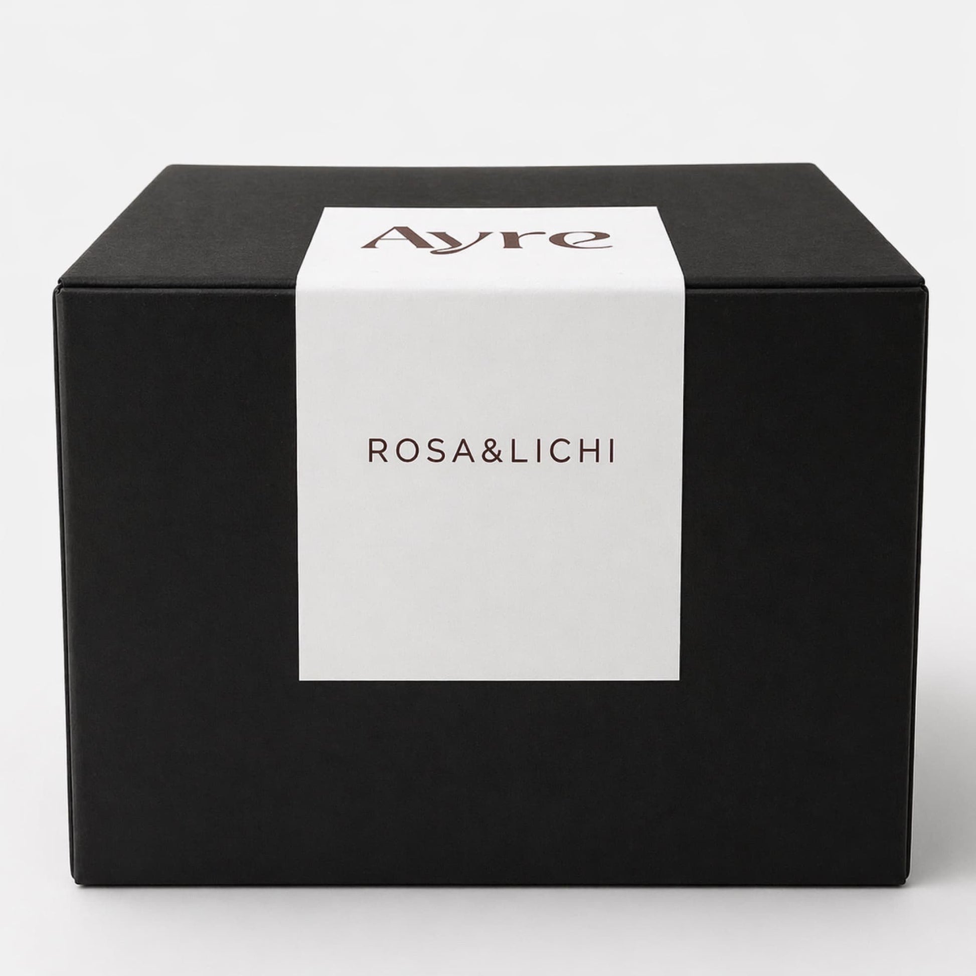 caja de vela de soja rosa y lichi ayre packaging