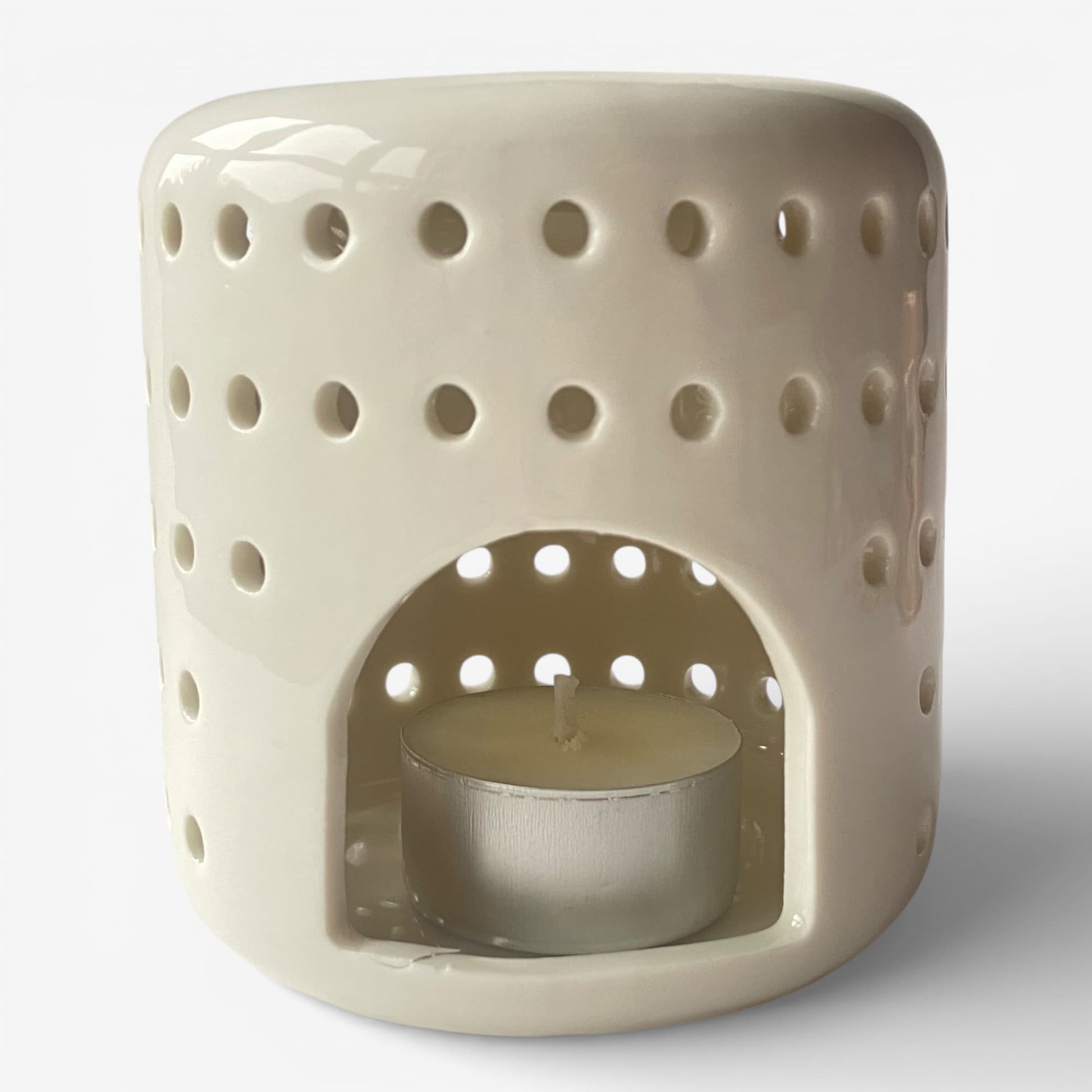 Quemador de ceras aromáticas Vesta con vela de té encendida