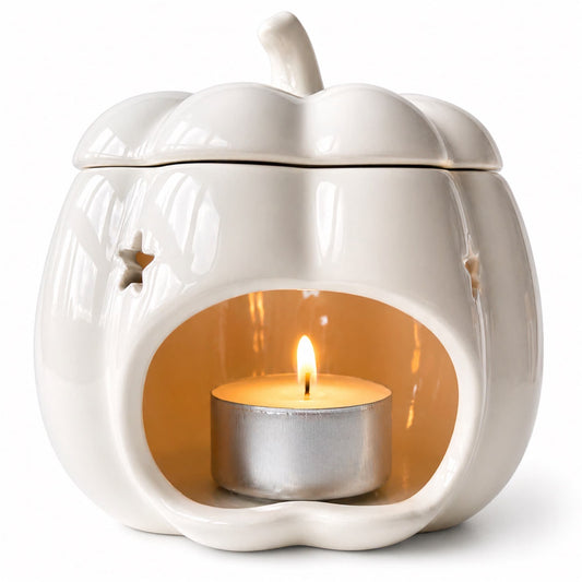 detalle quemador wax melts calabaza con vela de té encendida