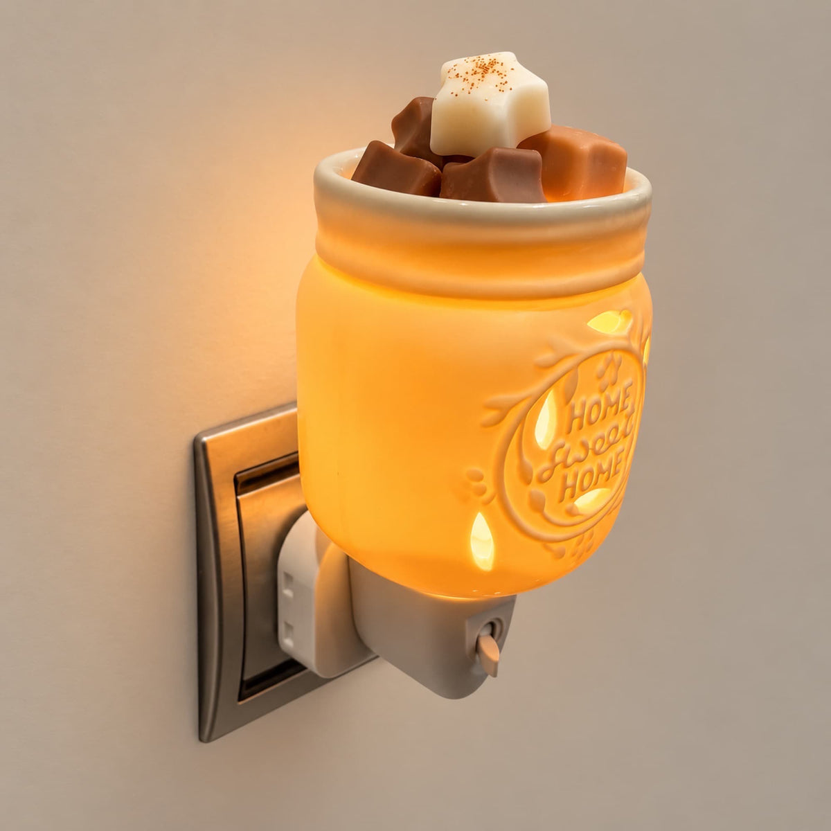 Quemador de wax melts enchufable Sweet Home encendido con wax melts