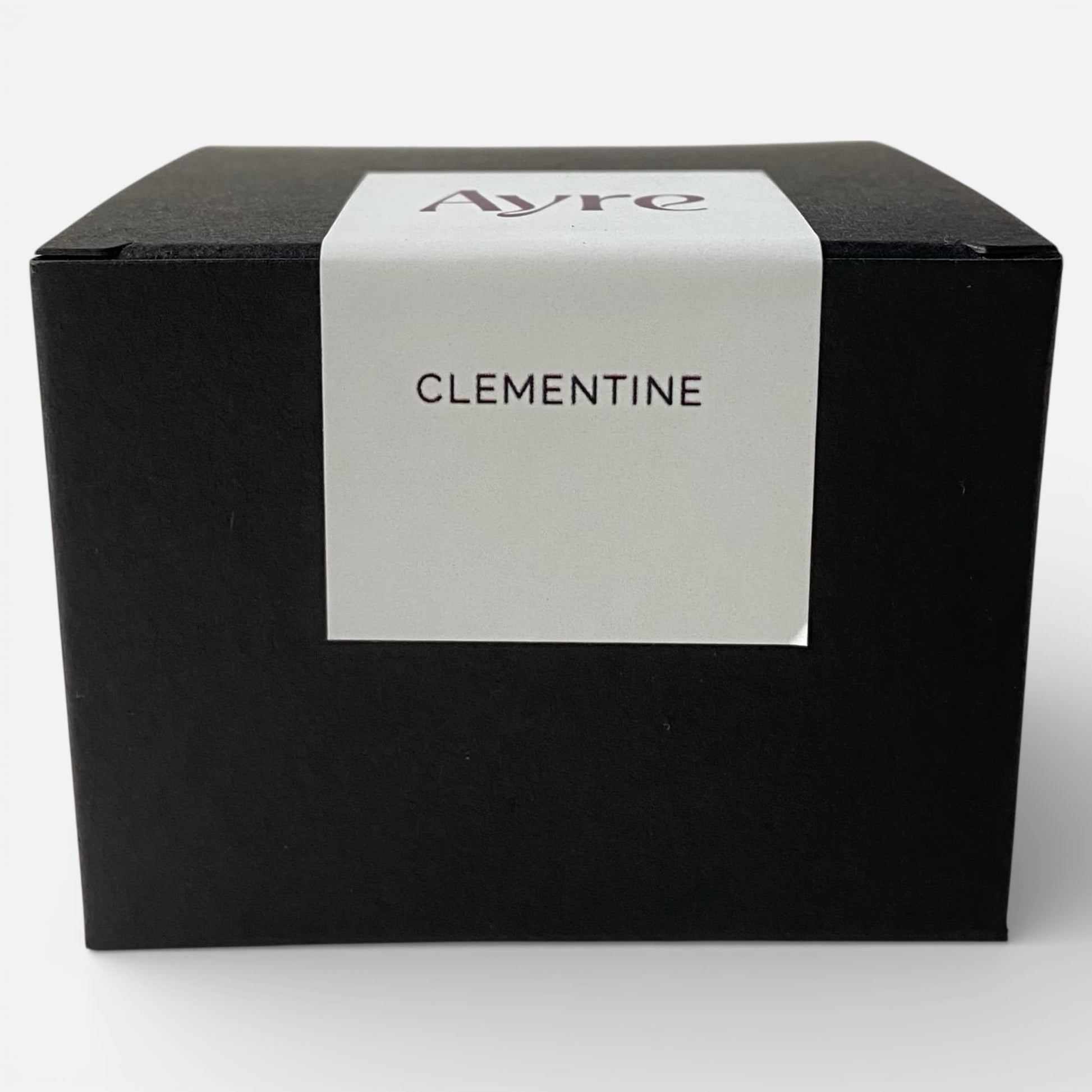 Caja de presentación de la vela aromática de soja Clementine Ayre.