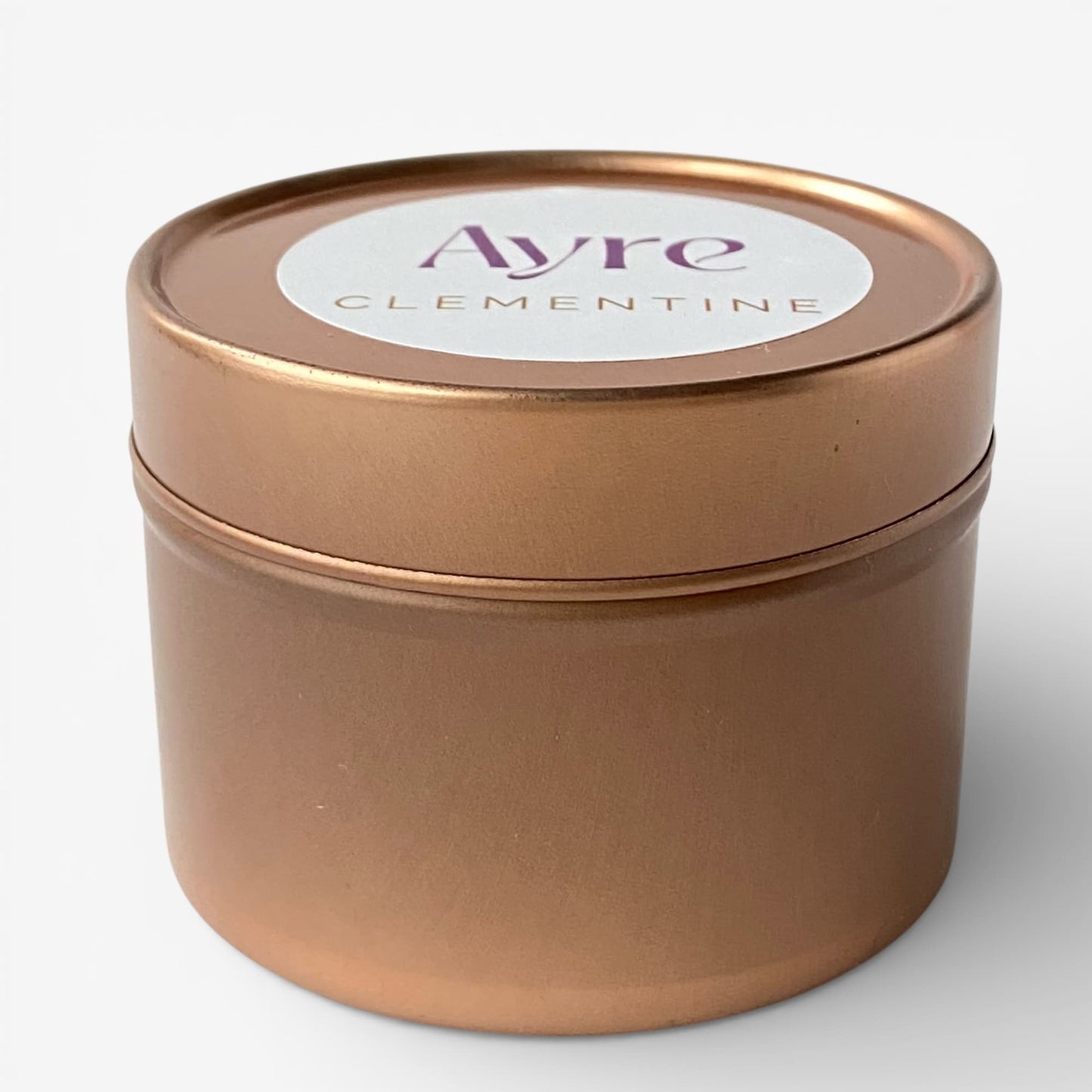 Vela aromática de soja Clementine Ayre en lata metálica.