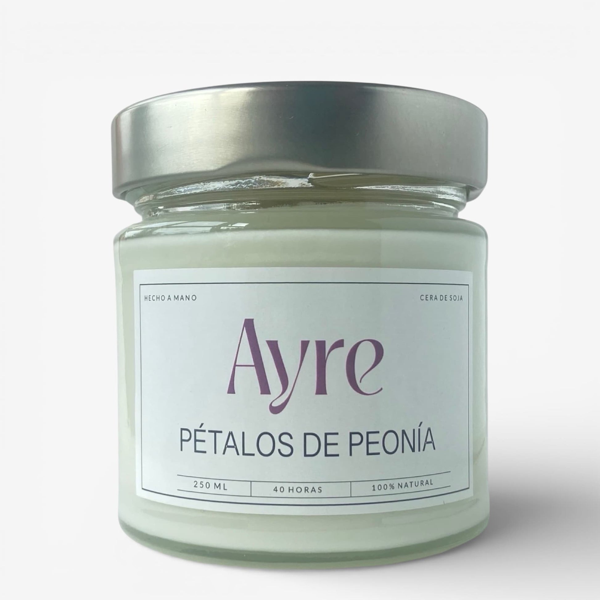 Vela aromática de soja Pétalos de Peonía Ayre en frasco de vidrio con tapa metálica y fragancia floral suave.