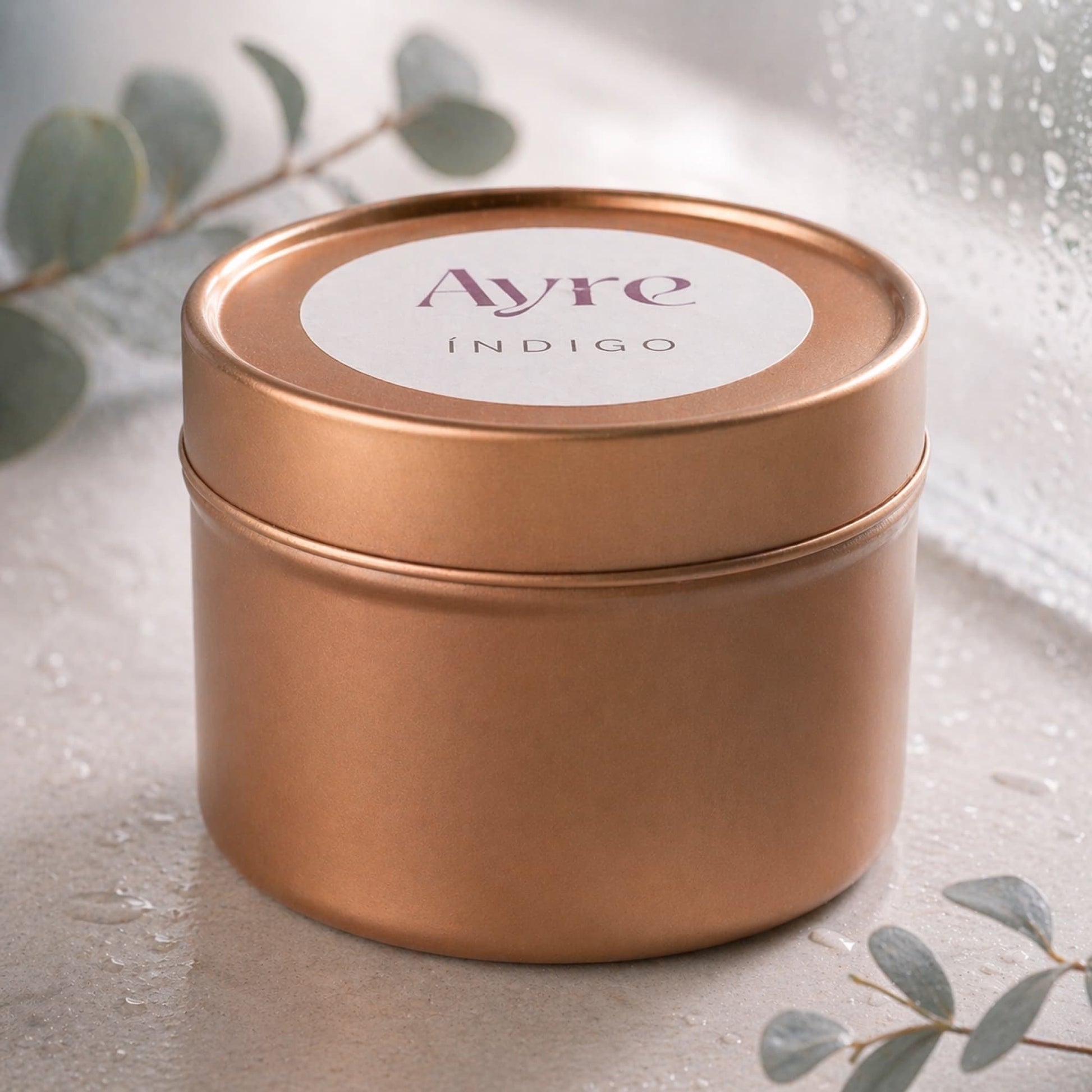 vela de soja indigo ayre en lata color oro rosa