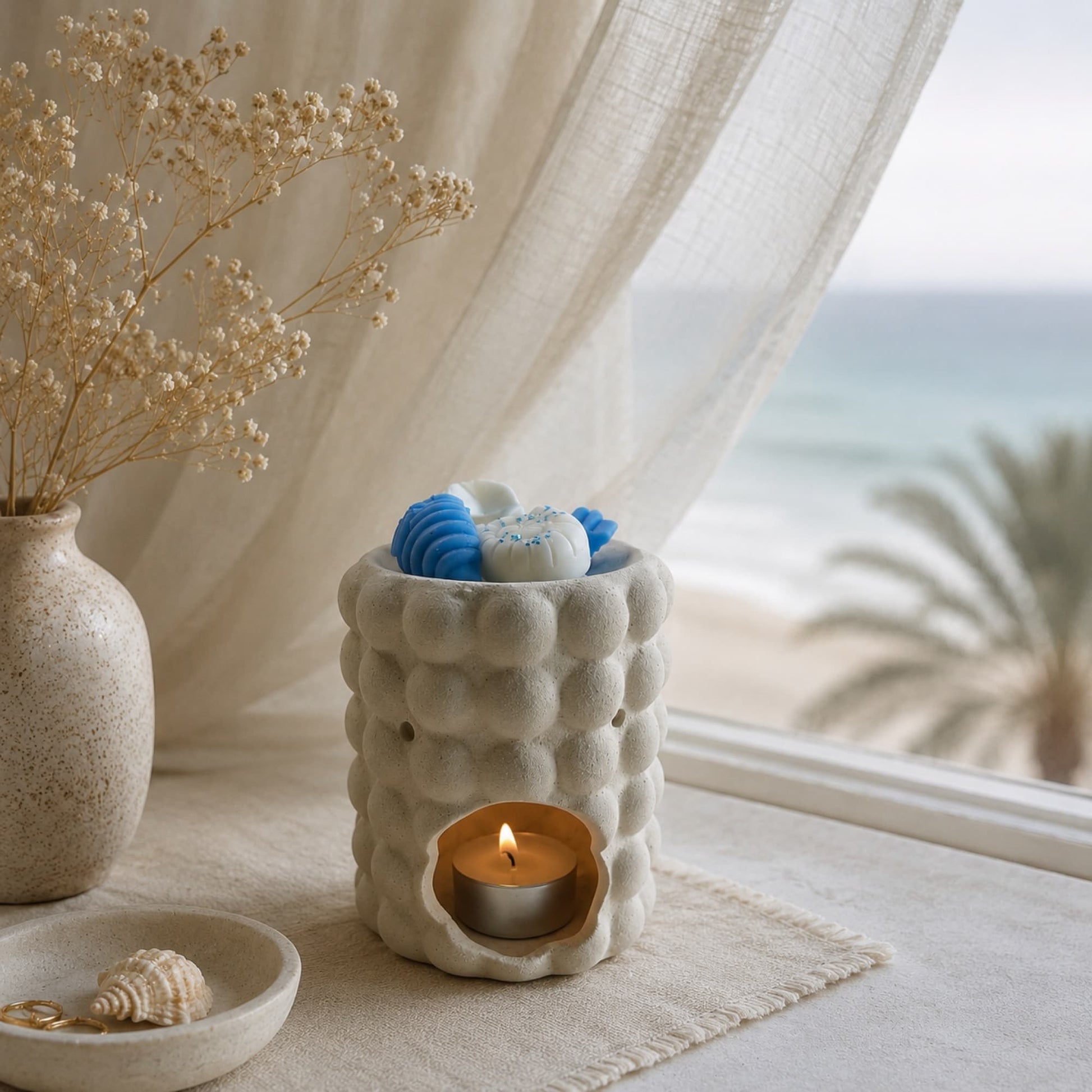 Wax melts Aguamarina fundiéndose en quemador de cerámica Ayre Candle
