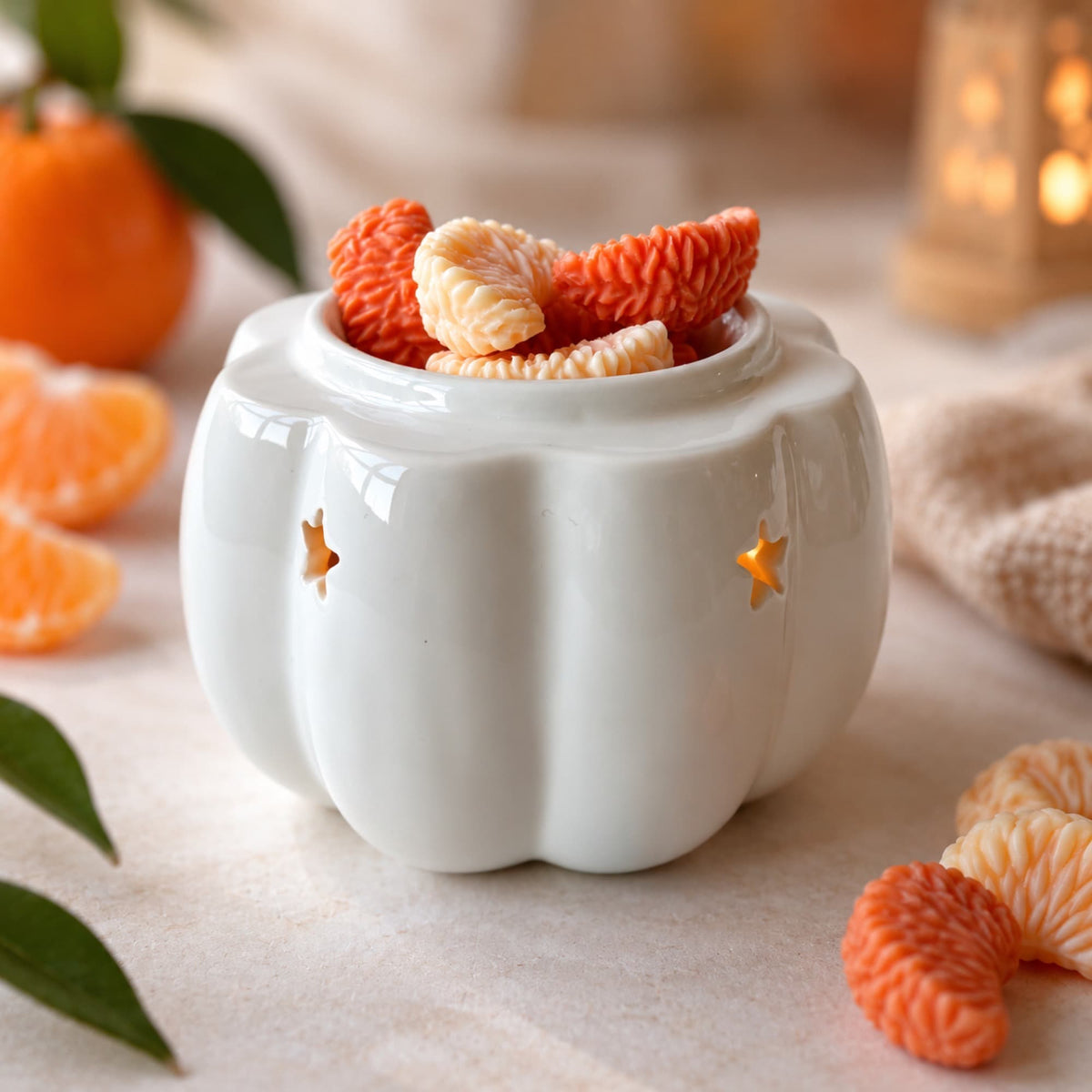 Wax melts aroma mandarina de Ayre en quemador con formas de gajos cítricos