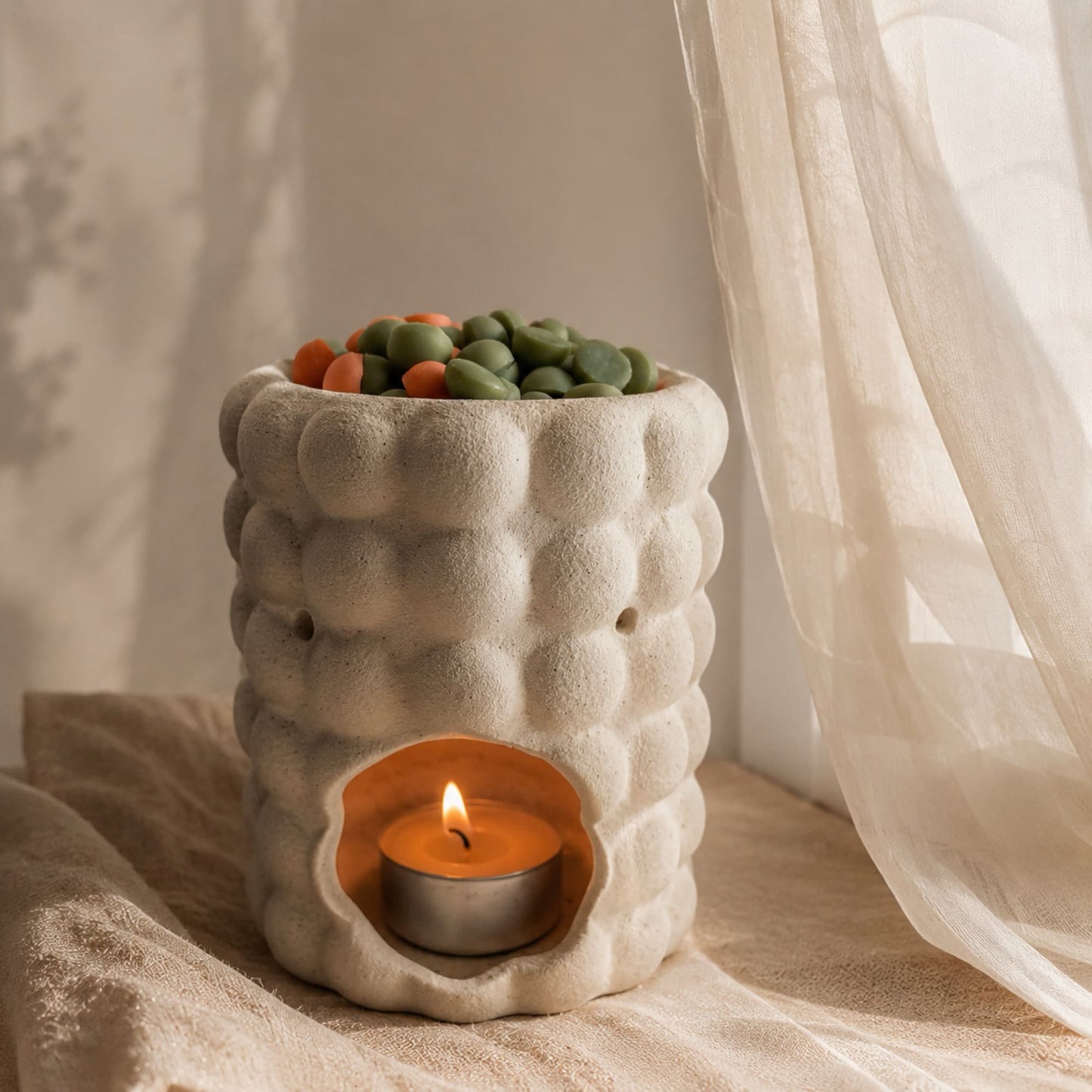 Wax melts aroma mango de Ayre derritiéndose en quemador cerámico