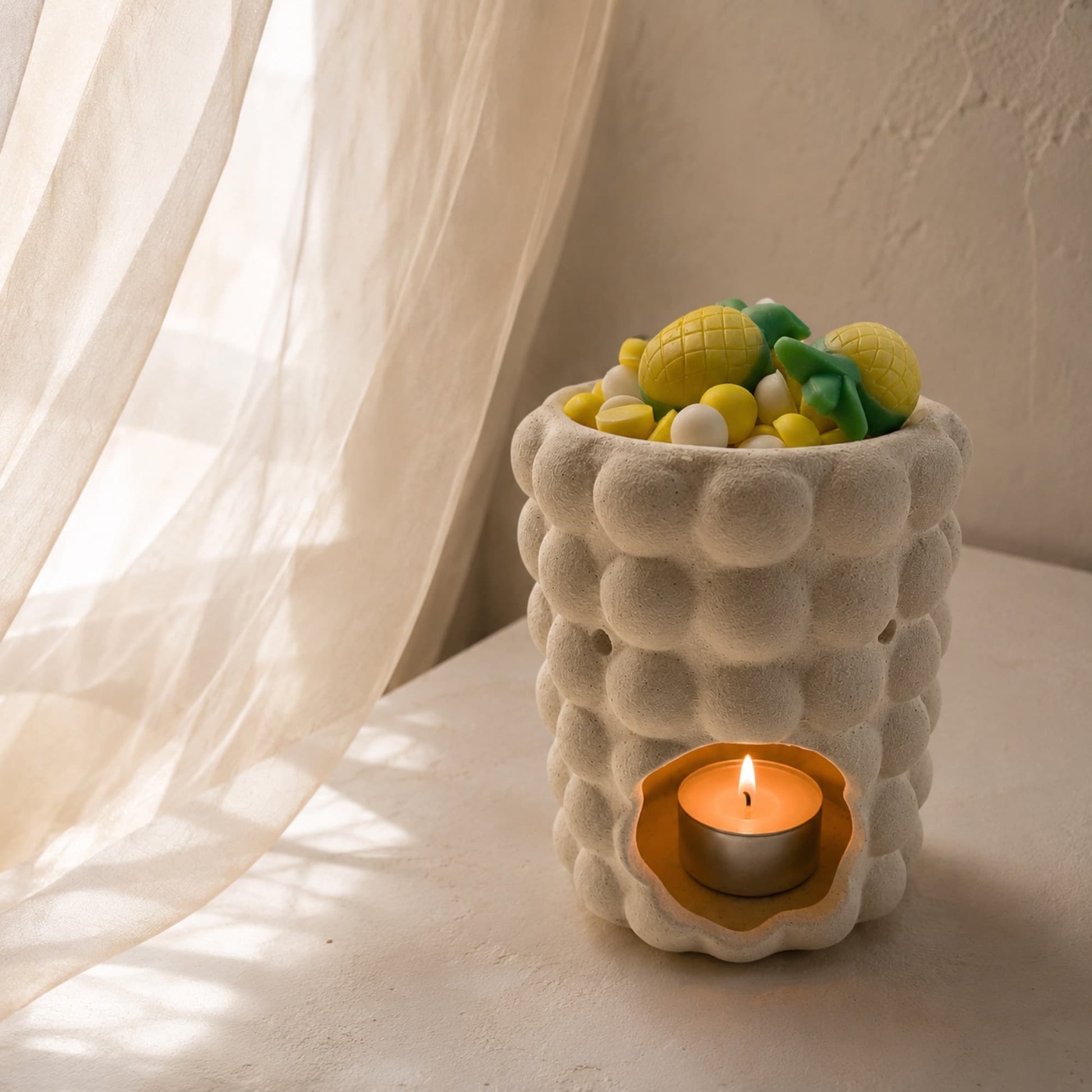 Wax melts Piña Colada de Ayre fundiéndose en quemador para aromatizar el hogar